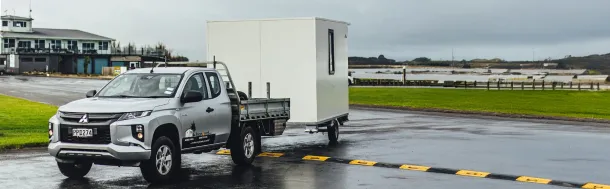 transporting portable cabin, highlighting an innovative way to combine travel and home- cabin rentals Manawatu